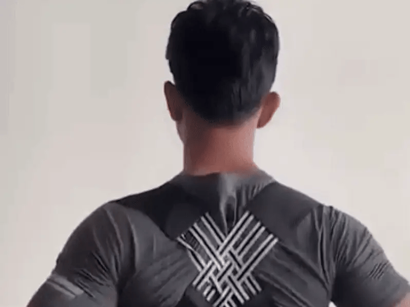 A person wearing the ShopArc Posture Corrector Belt, showcasing improved posture.